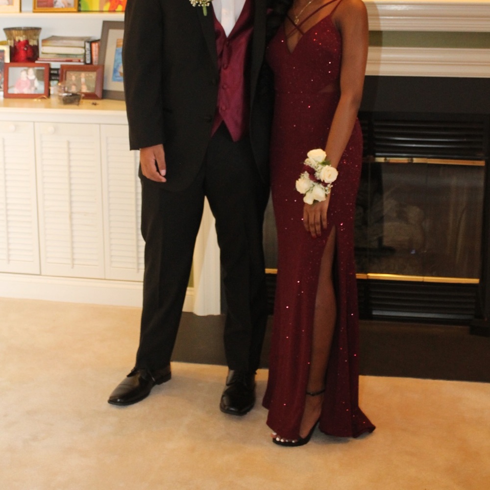 Sparkly Burgundy slit dress with an open back.